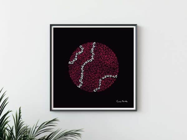 black art print in frame with red and white circle drawn in U shapes