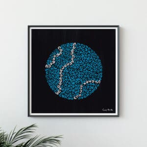 black art print in frame with blue and white circle drawn in U shapes