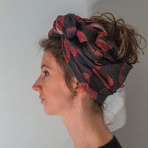 red and orange and black scarf turban or headwrap