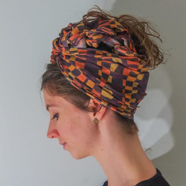 Orange and purple scarf with red and yellow, turban or headwrap