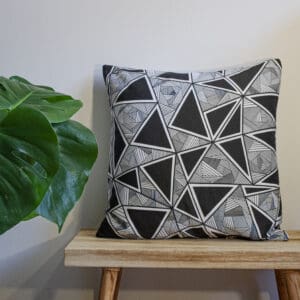 Black Throw Cushion and White Triangular, Geometric Pattern