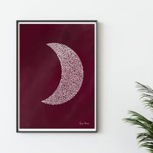 Image shows and unusual illustration of a red crescent moon poster printon a red sky background, in a frame